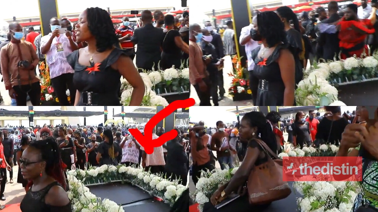Ghanaians take pictures with JJ's burial platform